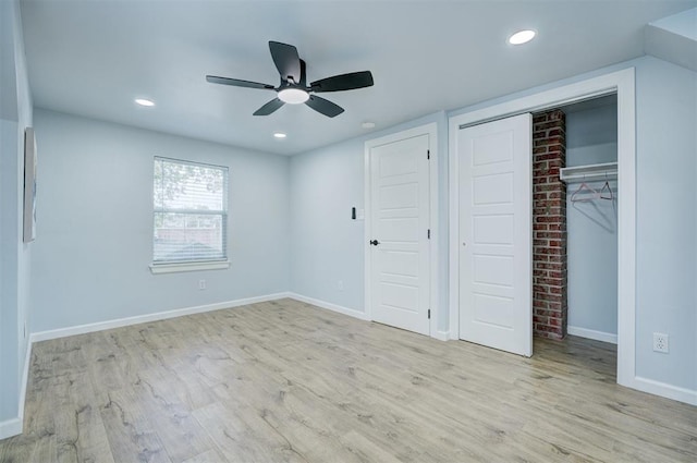 unfurnished bedroom featuring ceiling fan and light hardwood / wood-style floors