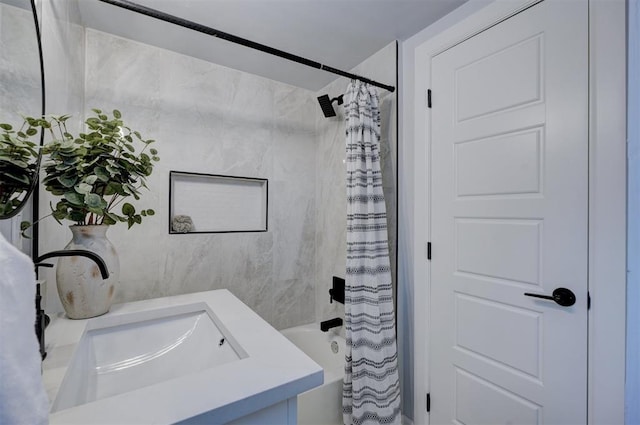 bathroom featuring vanity and shower / bathtub combination with curtain