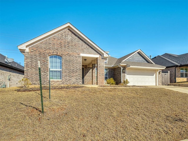 view of front of house featuring a garage and a front lawn