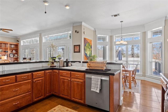 kitchen with dishwasher, decorative light fixtures, crown molding, and kitchen peninsula