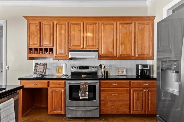 kitchen with ornamental molding, appliances with stainless steel finishes, dark tile patterned flooring, and backsplash