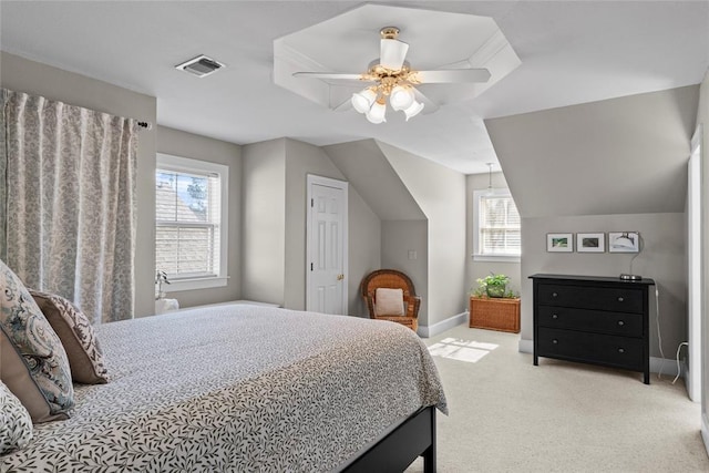 bedroom featuring vaulted ceiling, light carpet, and ceiling fan