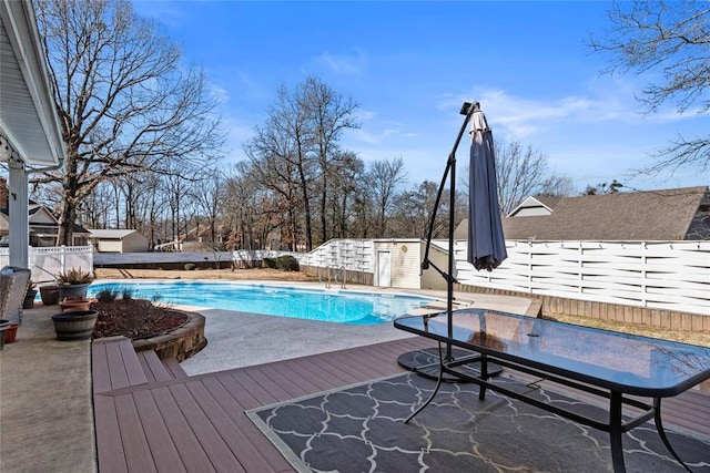 view of pool featuring a wooden deck