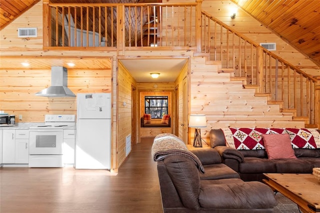 living room with hardwood / wood-style flooring, high vaulted ceiling, wooden ceiling, and wood walls