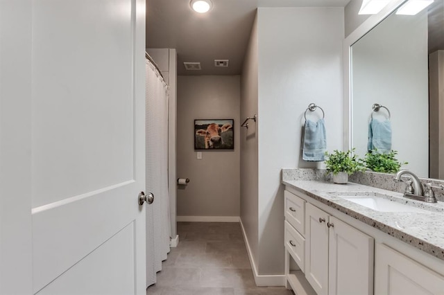 bathroom featuring vanity and tile patterned floors