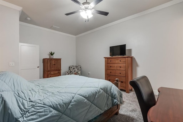 carpeted bedroom with crown molding and ceiling fan