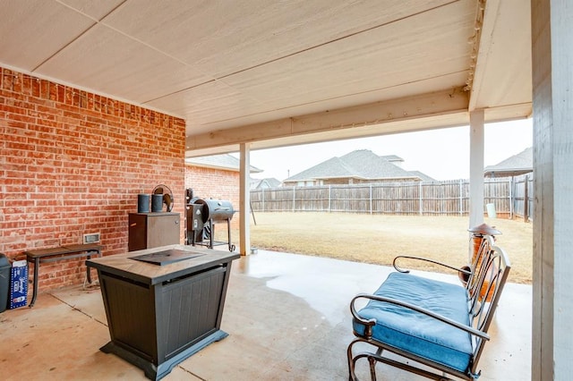 view of patio featuring area for grilling and an outdoor fire pit