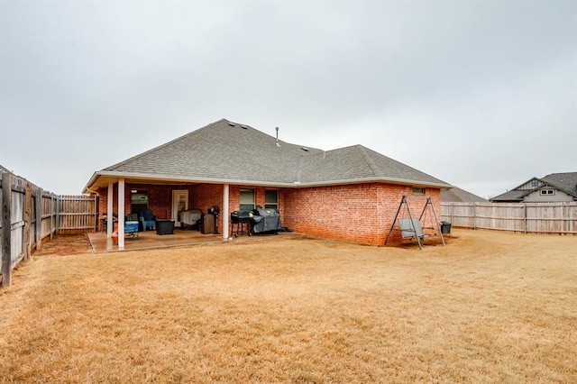 rear view of house with a patio