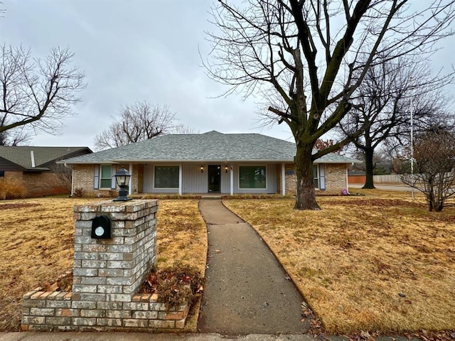 ranch-style home with a front yard