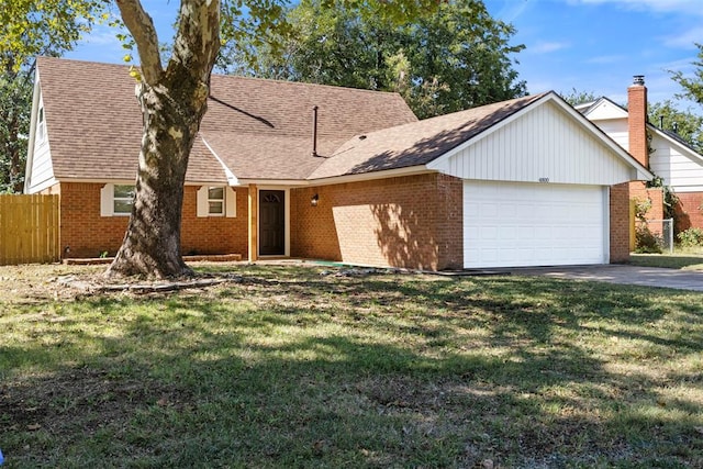 single story home featuring a garage and a front lawn