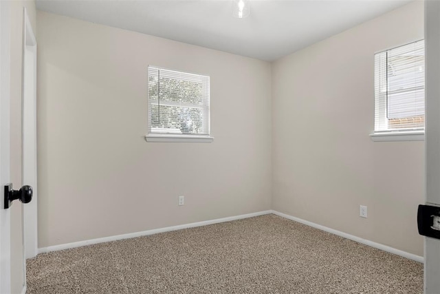 spare room with light colored carpet