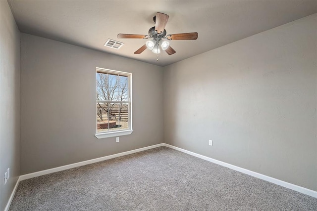 carpeted empty room featuring ceiling fan