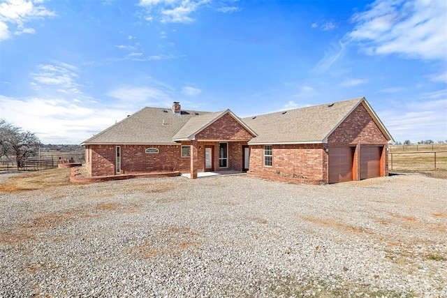 back of house with a garage