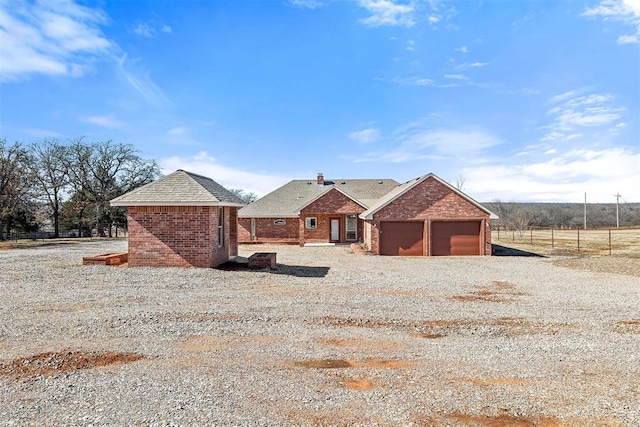 single story home featuring a garage