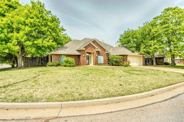 view of front of house with a garage and a front yard