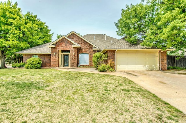 view of front of house with a garage and a front yard