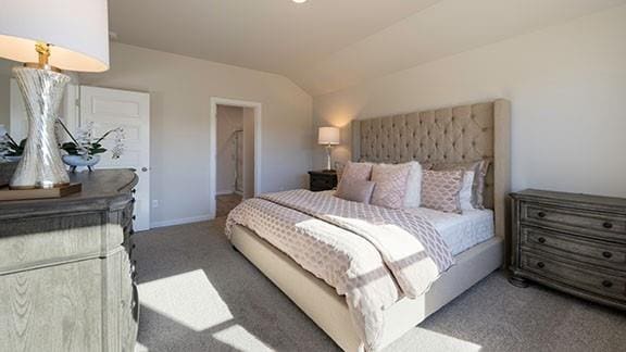 10225 NW 28th St, Yukon, OK 73099 - carpeted bedroom featuring lofted ceiling