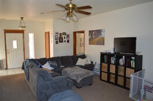 tiled living room featuring ceiling fan