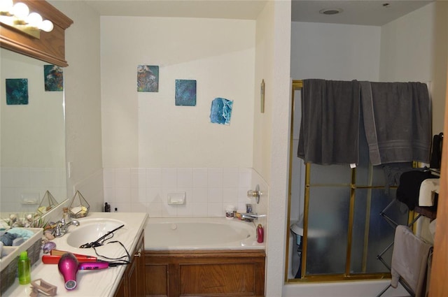 bathroom featuring vanity and separate shower and tub