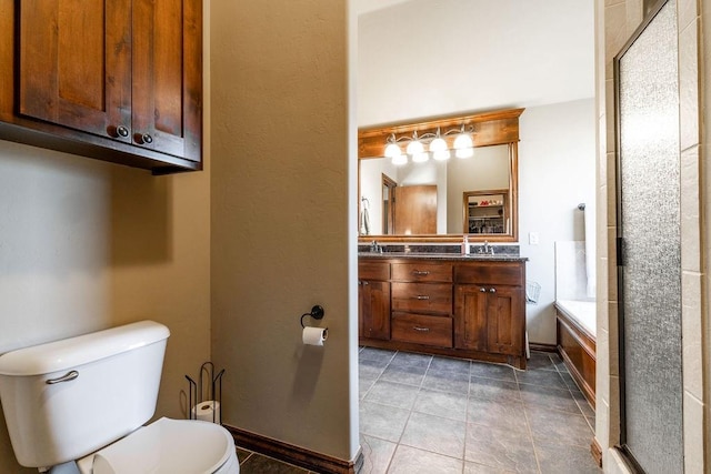 full bathroom with tile patterned flooring, vanity, shower with separate bathtub, and toilet