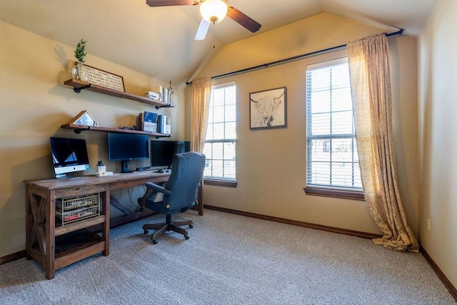 office featuring vaulted ceiling, carpet, and ceiling fan