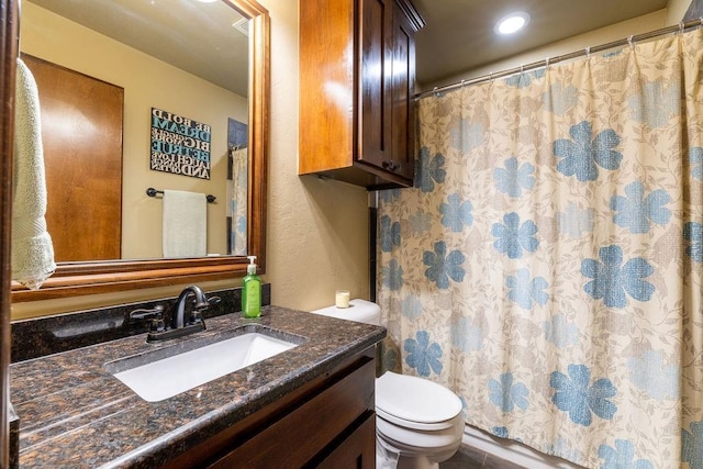 bathroom with vanity, a shower with curtain, and toilet