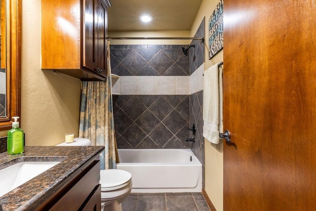 full bathroom with tile patterned floors, vanity, toilet, and shower / bath combo