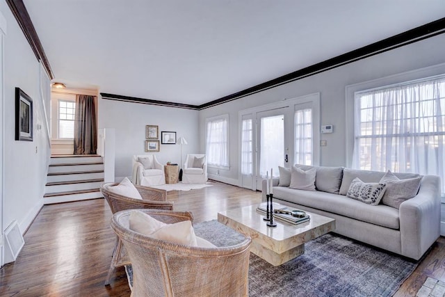 living room featuring crown molding and dark hardwood / wood-style floors