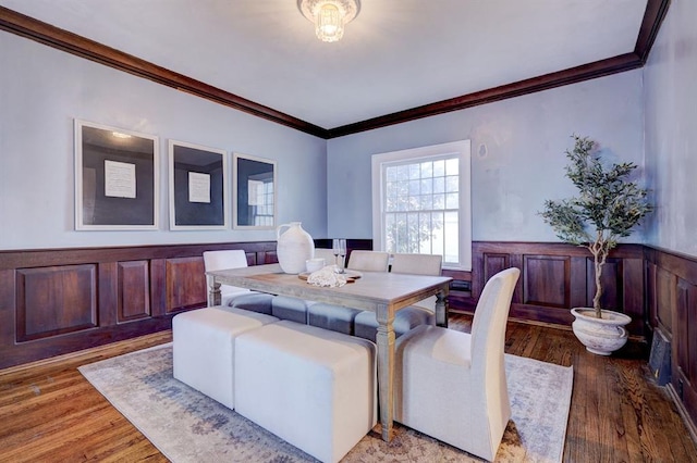 office space with wood-type flooring and ornamental molding