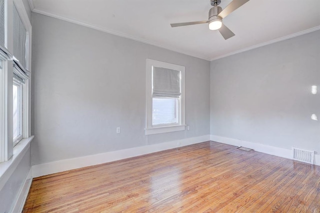 unfurnished room featuring ceiling fan, ornamental molding, and light hardwood / wood-style flooring