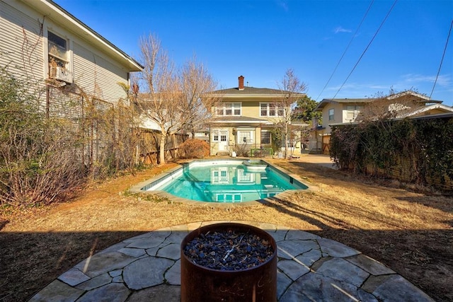 view of pool featuring a fire pit and a patio