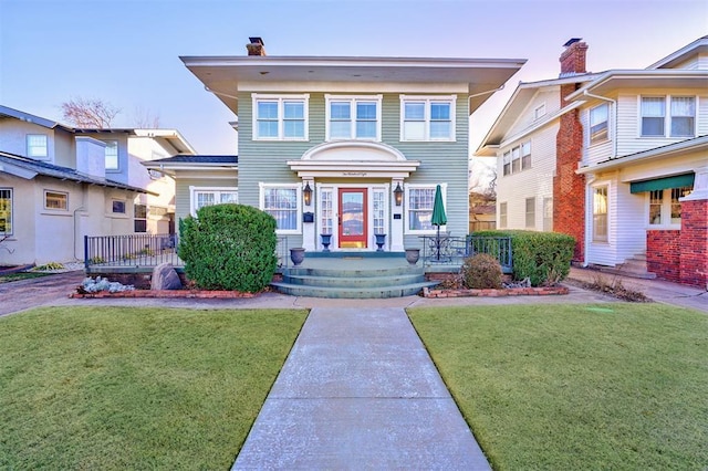208 NW 20th St, Oklahoma City, OK 73103 - view of front facade with a front yard and a chimney