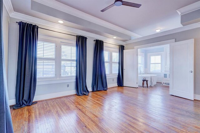 208 NW 20th St, Oklahoma City, OK 73103 - spare room featuring light wood-style floors, ornamental molding, and ceiling fan