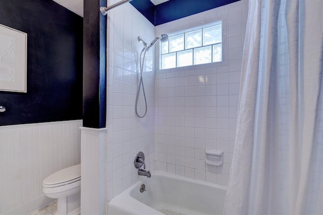 208 NW 20th St, Oklahoma City, OK 73103 - bathroom with toilet, shower / bathtub combination with curtain, and wainscoting