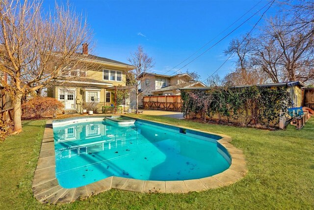 208 NW 20th St, Oklahoma City, OK 73103 - view of pool featuring a yard, a fenced backyard, a fenced in pool, and an outbuilding