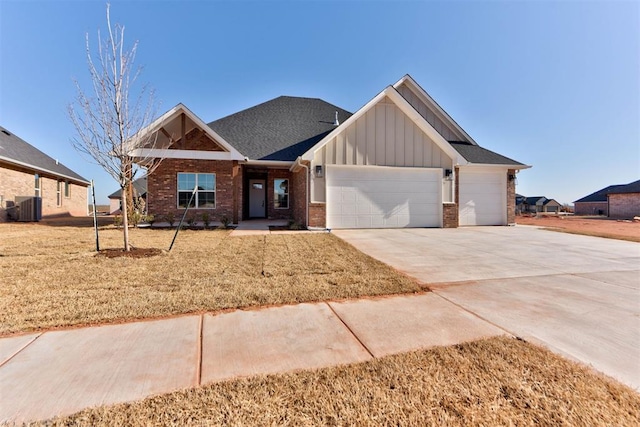 craftsman inspired home with board and batten siding, concrete driveway, an attached garage, brick siding, and central AC unit