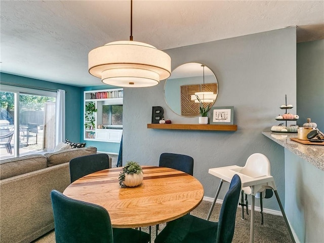 dining space with carpet