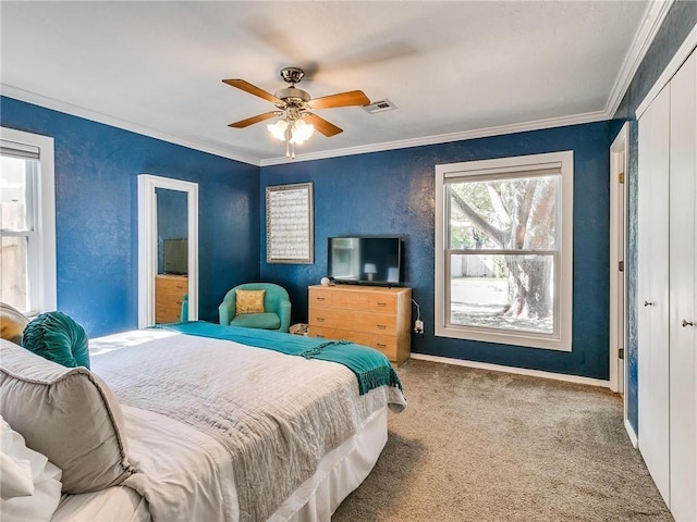 bedroom featuring crown molding, light carpet, and ceiling fan