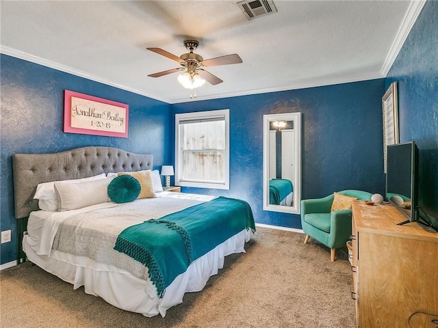 bedroom with crown molding, ceiling fan, and carpet