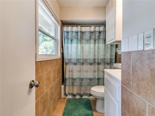 full bathroom featuring tile walls, tile patterned flooring, vanity, shower / bath combination with curtain, and toilet