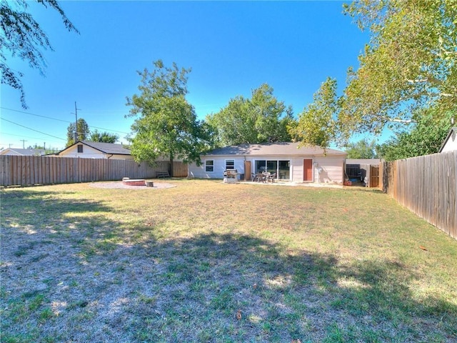 view of yard with an outdoor fire pit