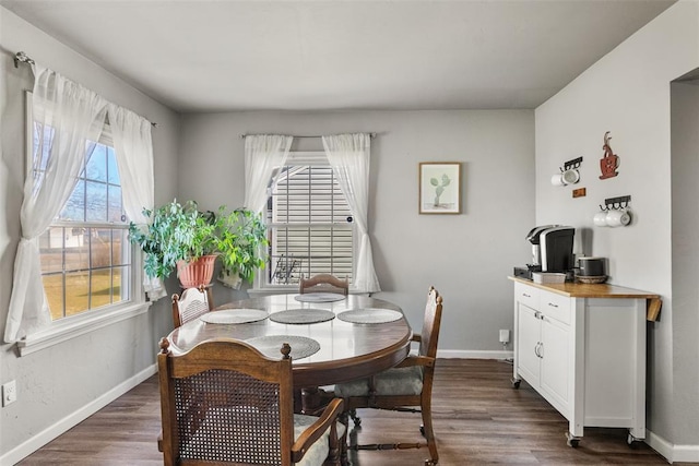 dining area with dark hardwood / wood-style flooring