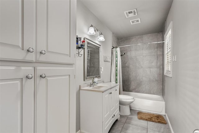 full bathroom featuring shower / tub combo, vanity, tile patterned floors, and toilet