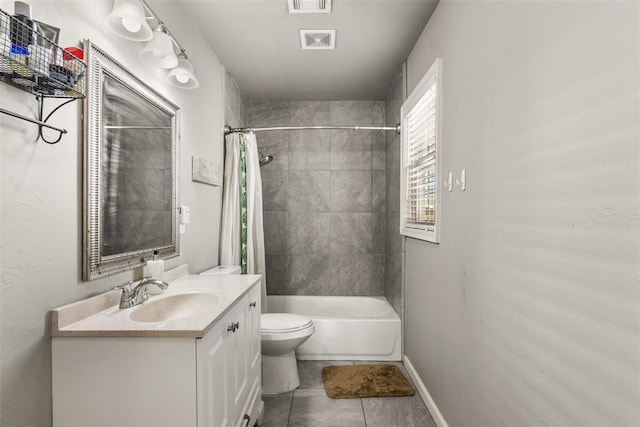 full bathroom featuring vanity, toilet, tile patterned flooring, and shower / bath combo with shower curtain