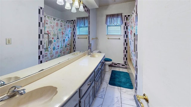 bathroom featuring vanity, curtained shower, and toilet