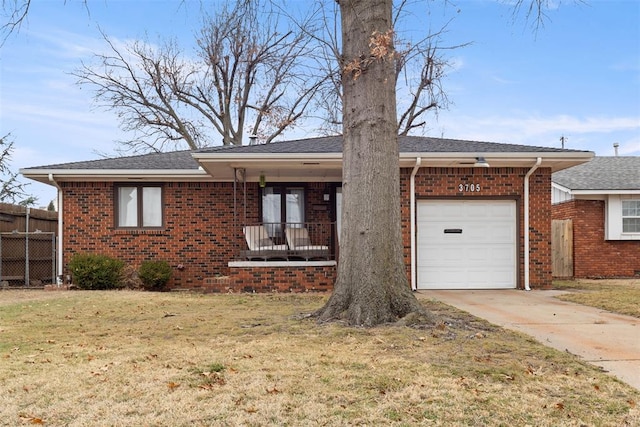 single story home with a garage and a front yard