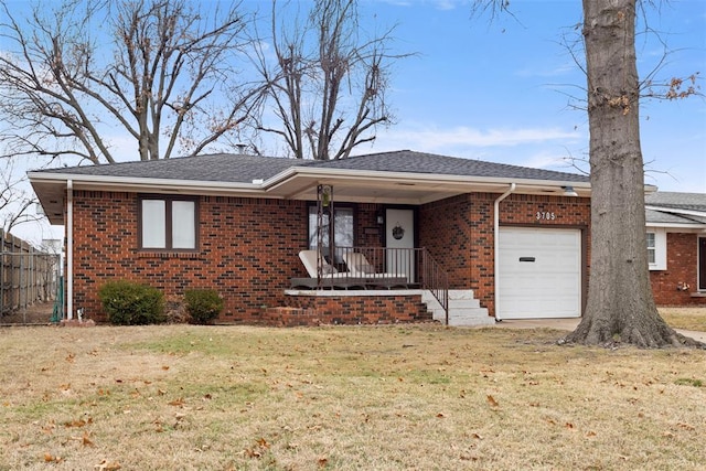 view of front of house with a garage and a front lawn