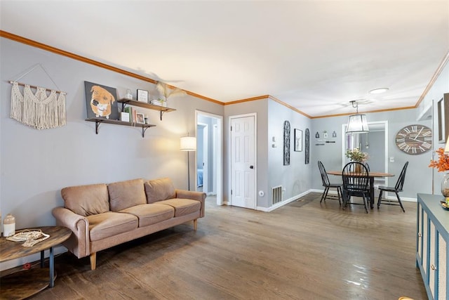 living room featuring crown molding and dark hardwood / wood-style floors