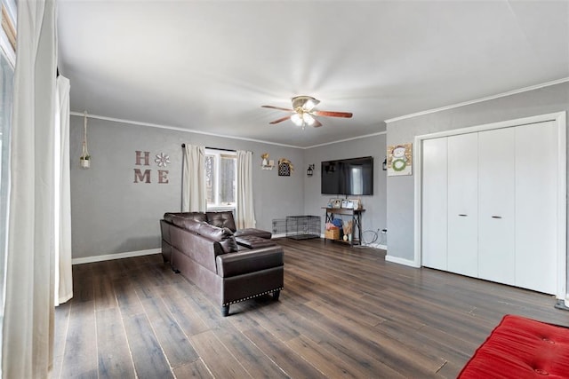 living room featuring crown molding, dark hardwood / wood-style floors, and ceiling fan