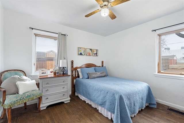 bedroom with ceiling fan and dark hardwood / wood-style flooring